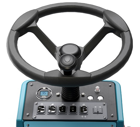 A closeup of the steering wheel and operator controls for the Tennant S960 battery ride-on sweeper.